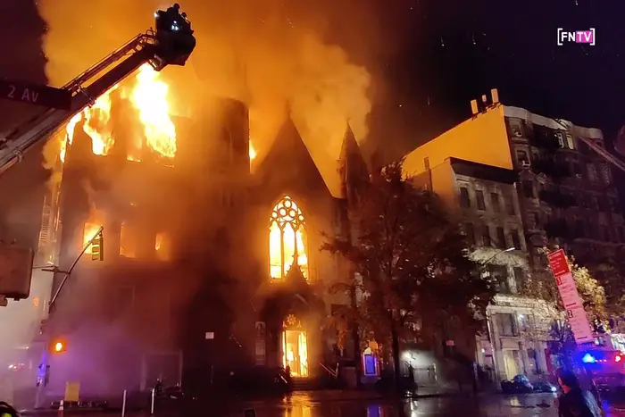 Images of fire ravaging a vacant building and the Middle Collegiate Church on East 7th Street, with the fire department responding with ground and ladder hoses